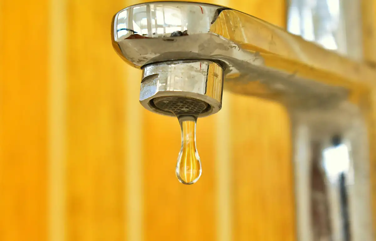 water damage caused by leaking faucet